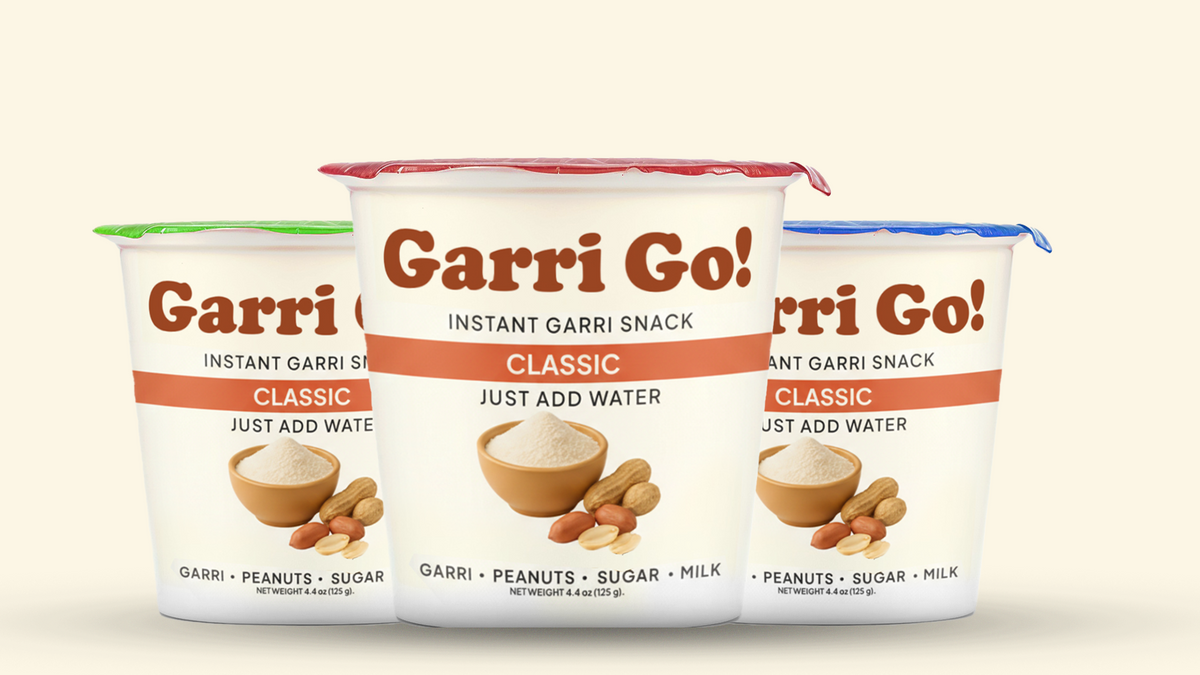 Three containers of Garri Go! instant garri snack on a beige background